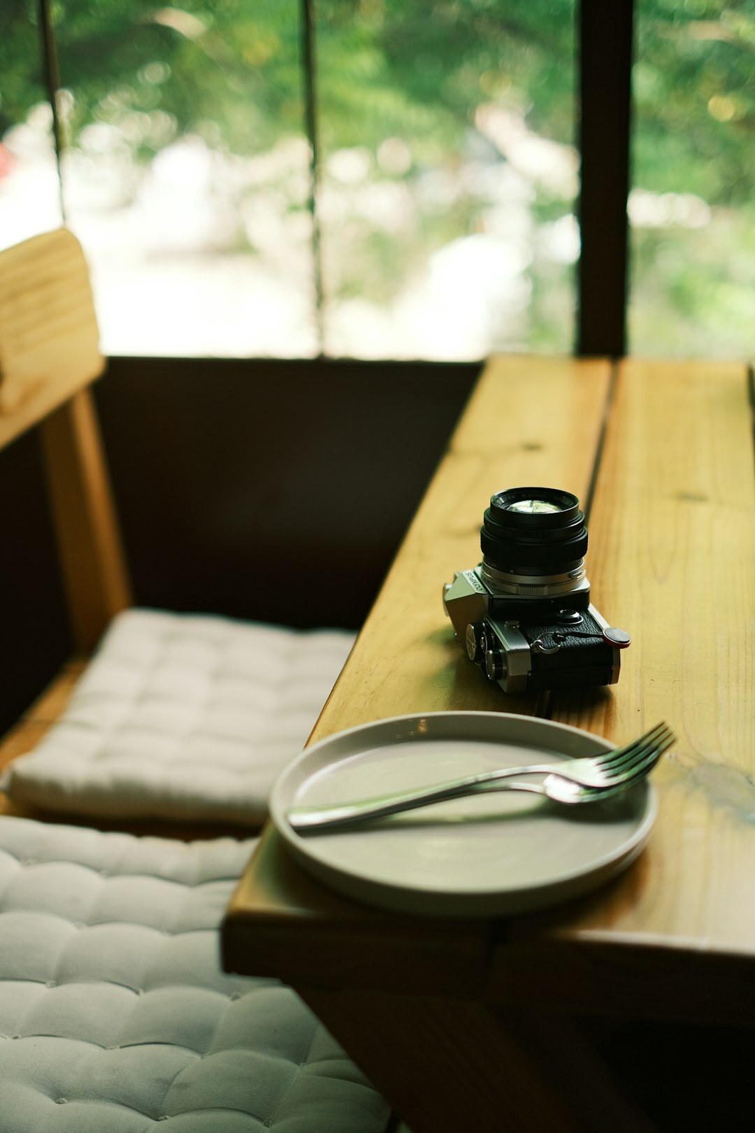 Professional camera and photography equipment on a wooden table